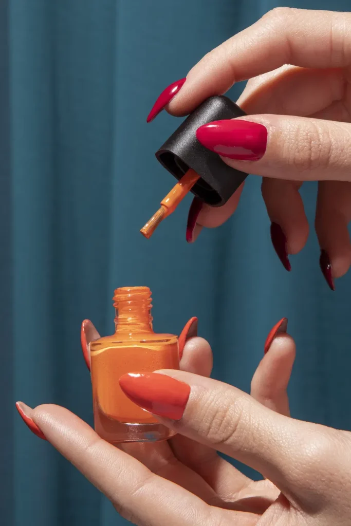 Almond-shaped acrylic nails in soft peach shade